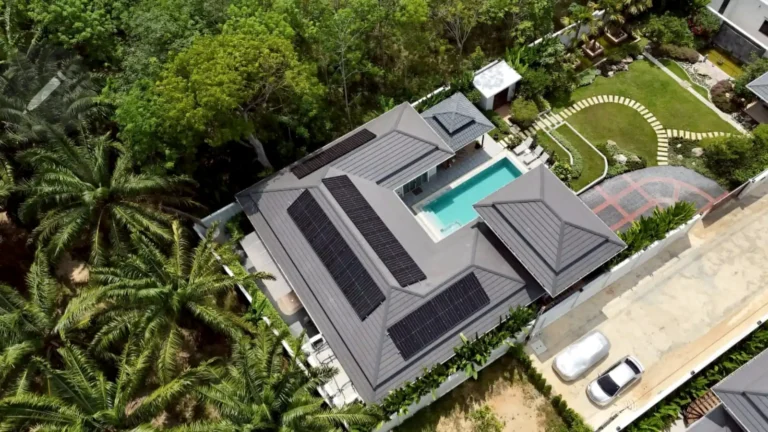 Modern luxury home with rooftop solar power system and swimming pool